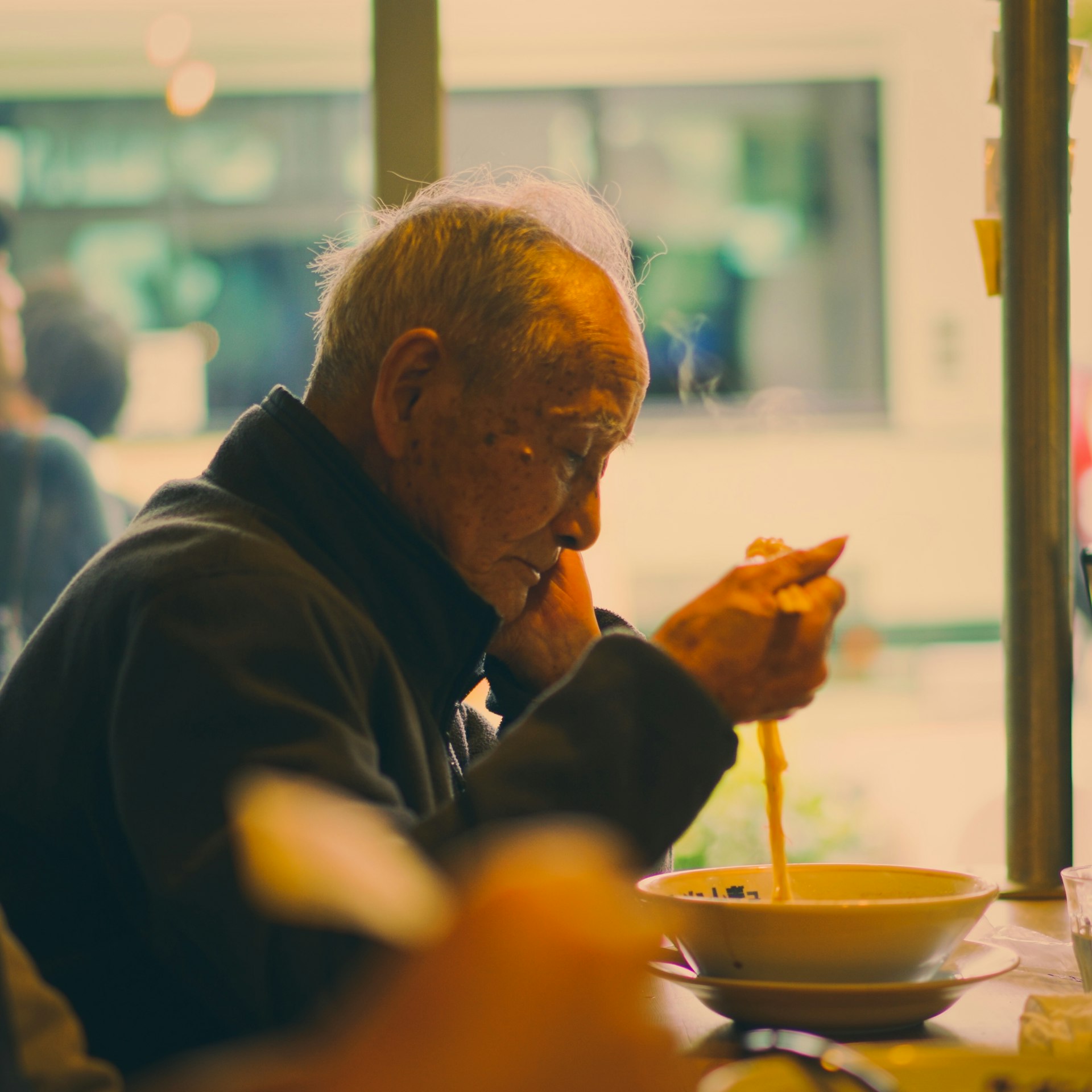 a man eating a hot dog